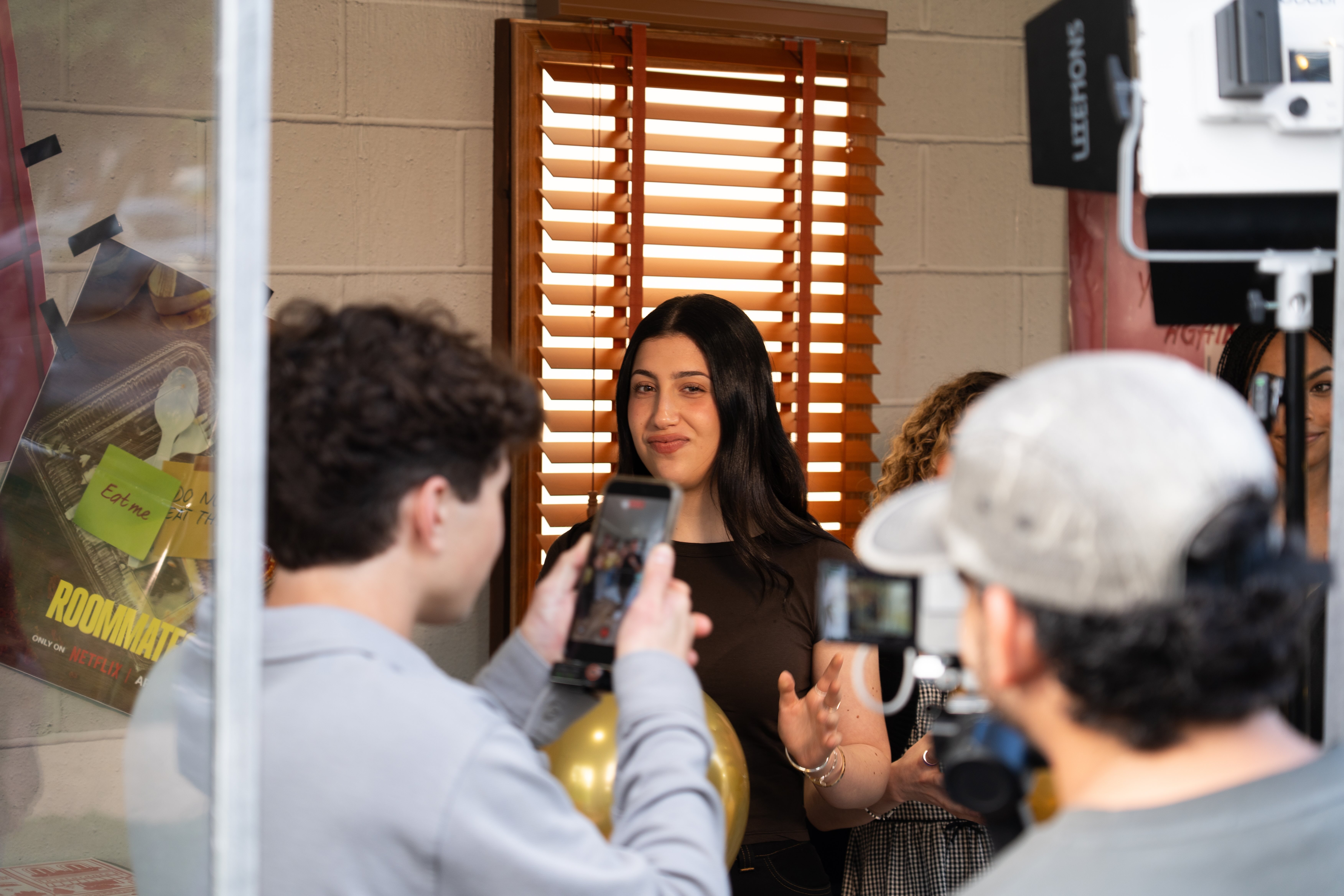 Sadie Sandler filming content inside the installation